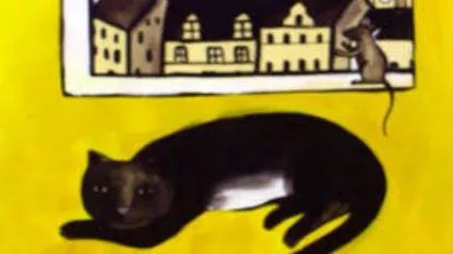 gatto nero sdraiato con topo sulla finestrA